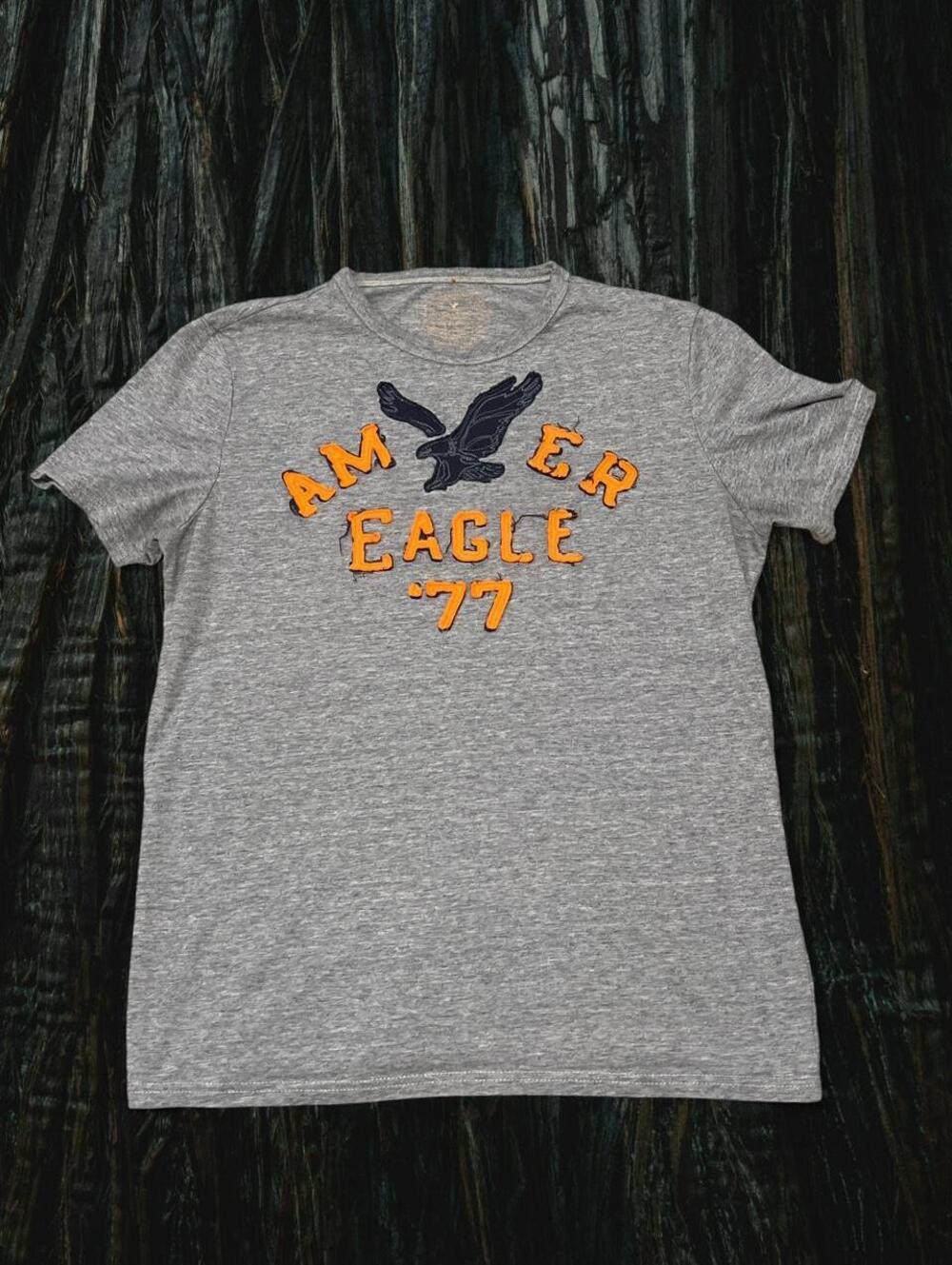 American Eagle Outfitters gray tee with black/orange eagle graphic, size M
